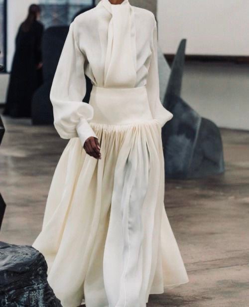 watercolor painting of building near sea