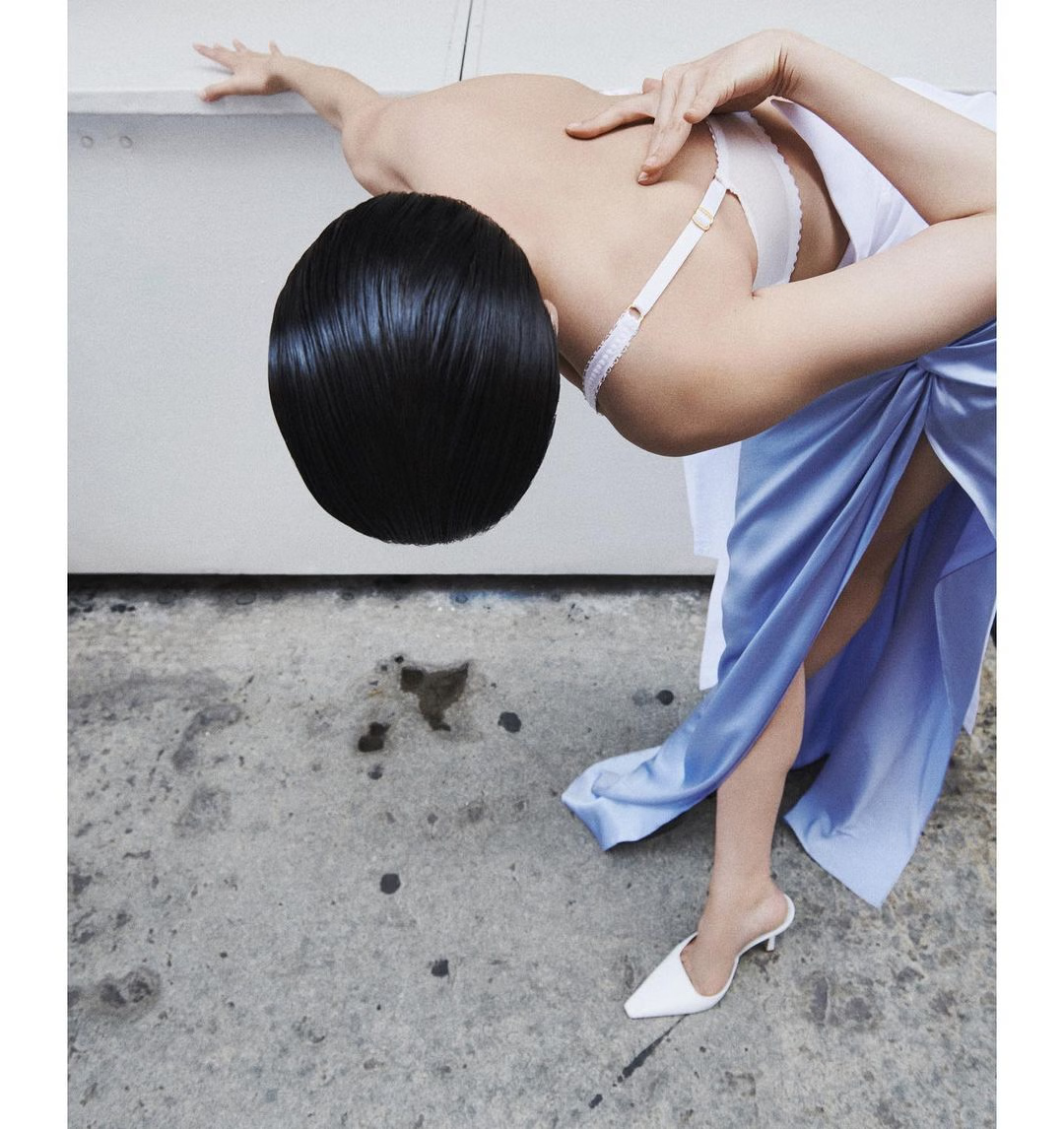 photograph of man holding face