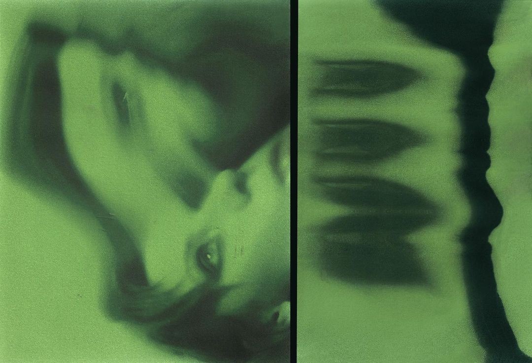 photograph of man holding face