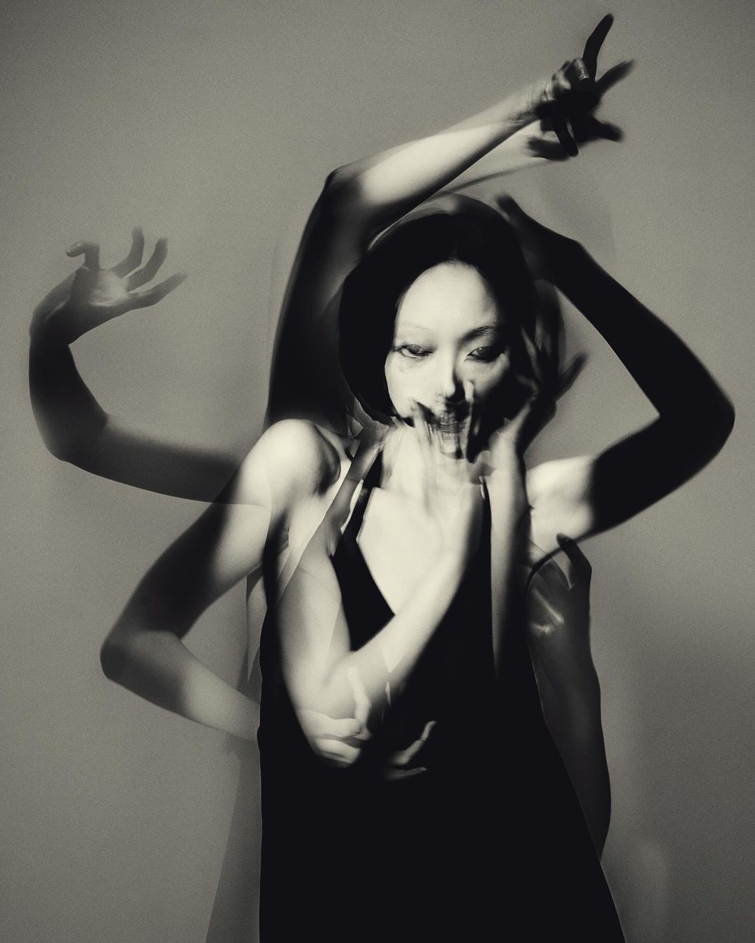 abstract sculpture with flower in vase