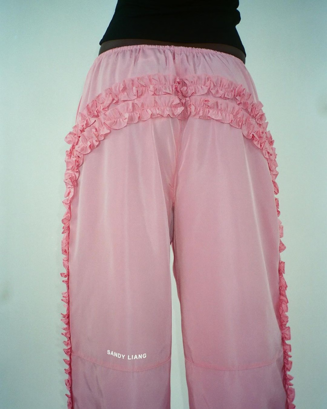 photograph of man holding balloons