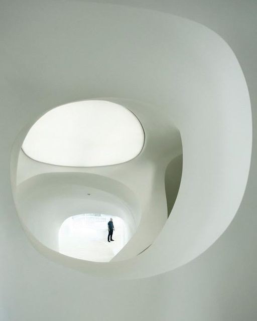 abstract sculpture with flower in vase