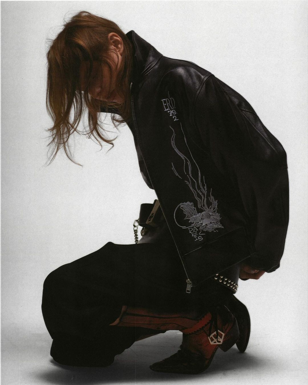 abstract sculpture with flower in vase