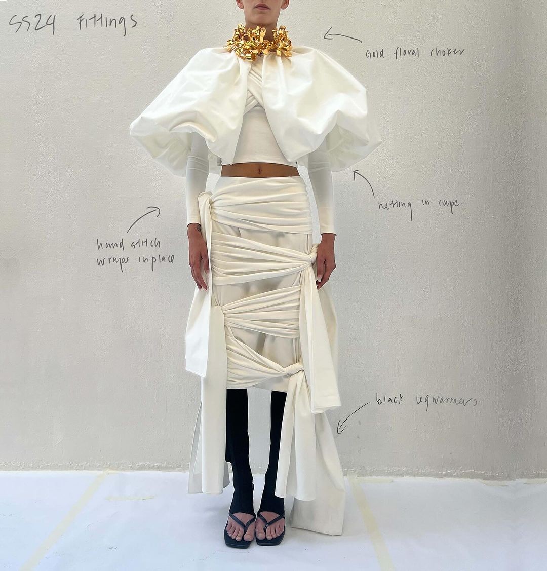 watercolor painting of building near sea