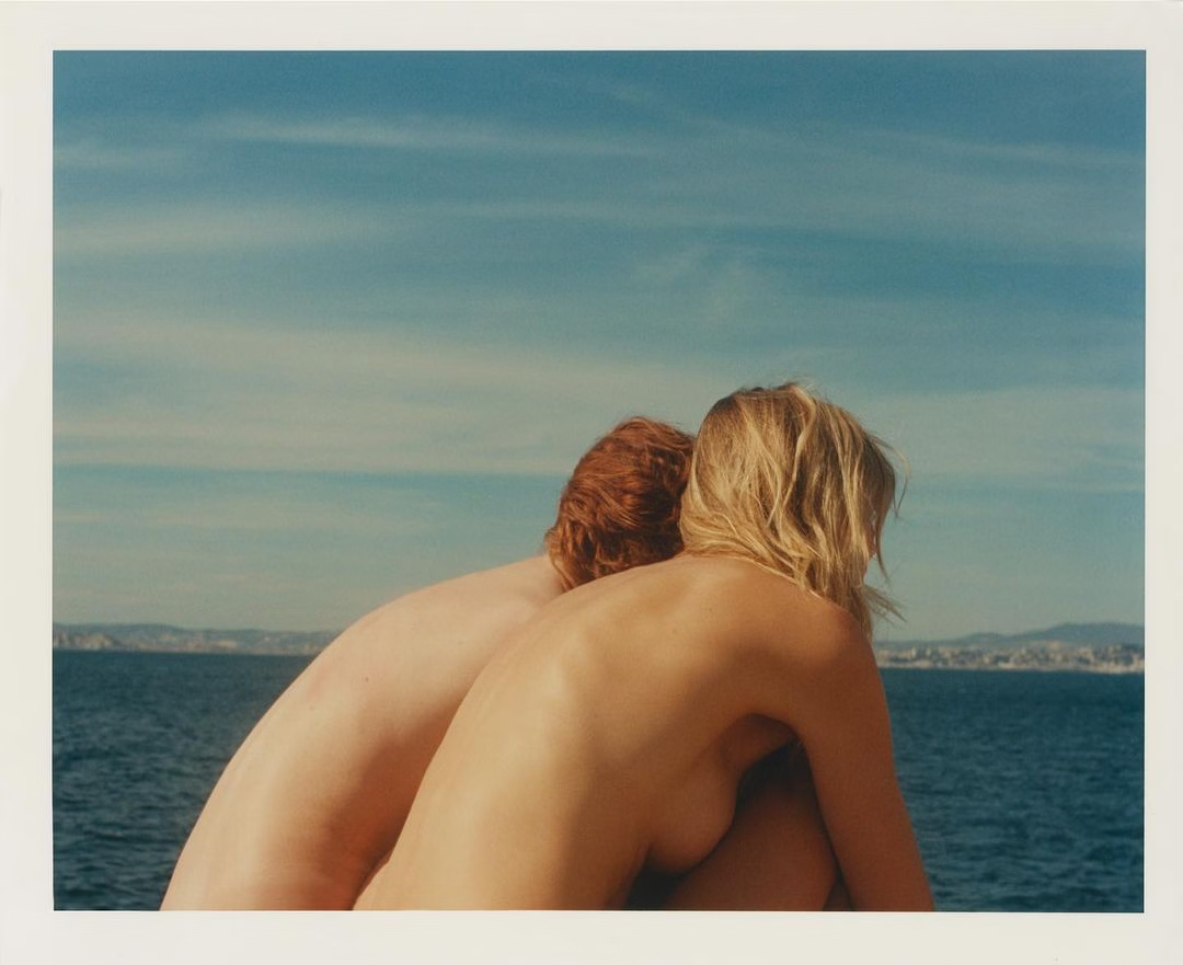 watercolor painting of building near sea