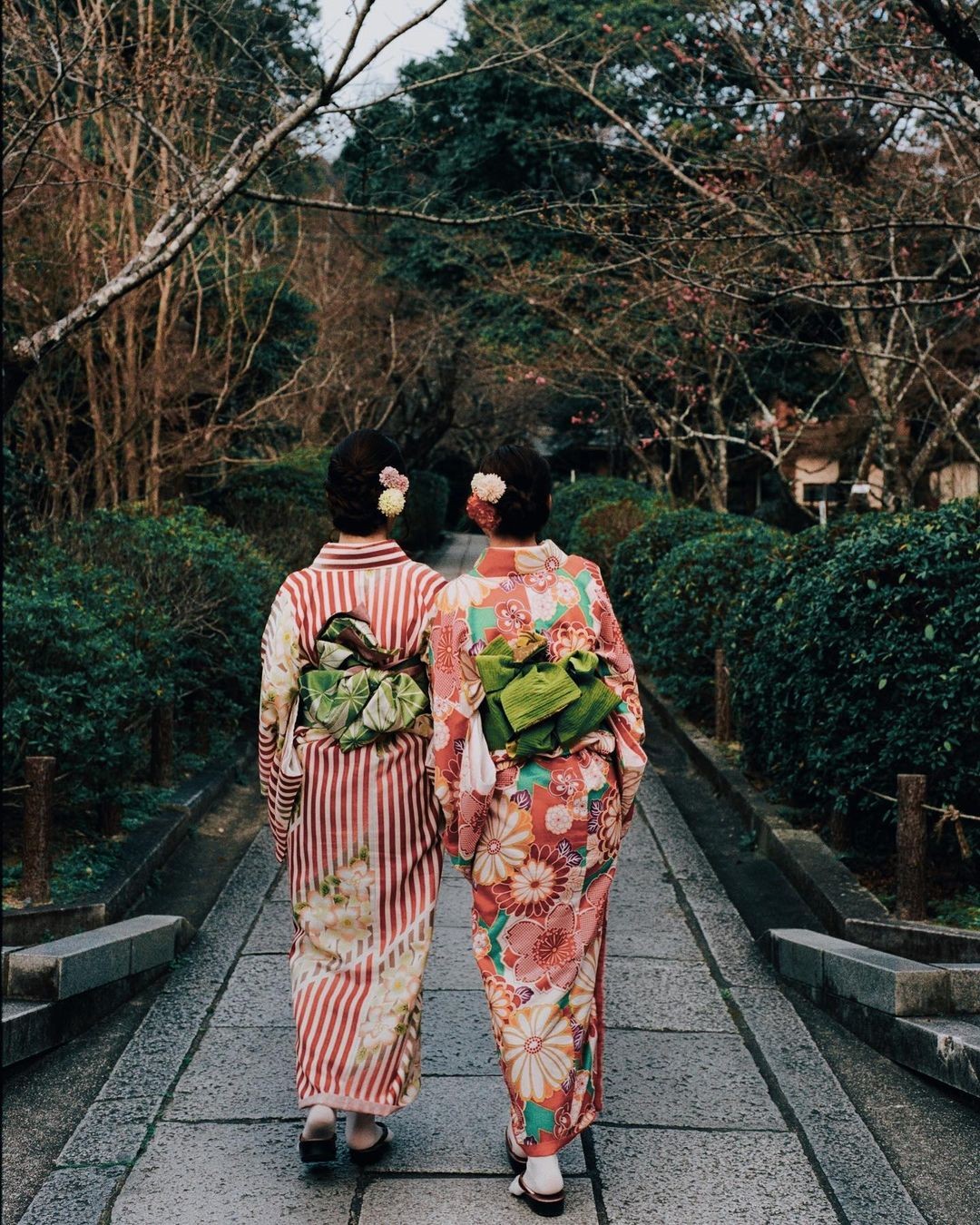 abstract sculpture with flower in vase