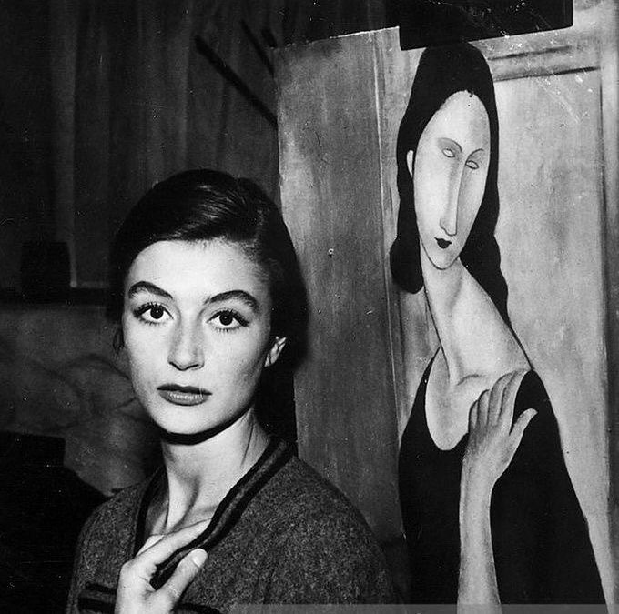 photograph of man holding face